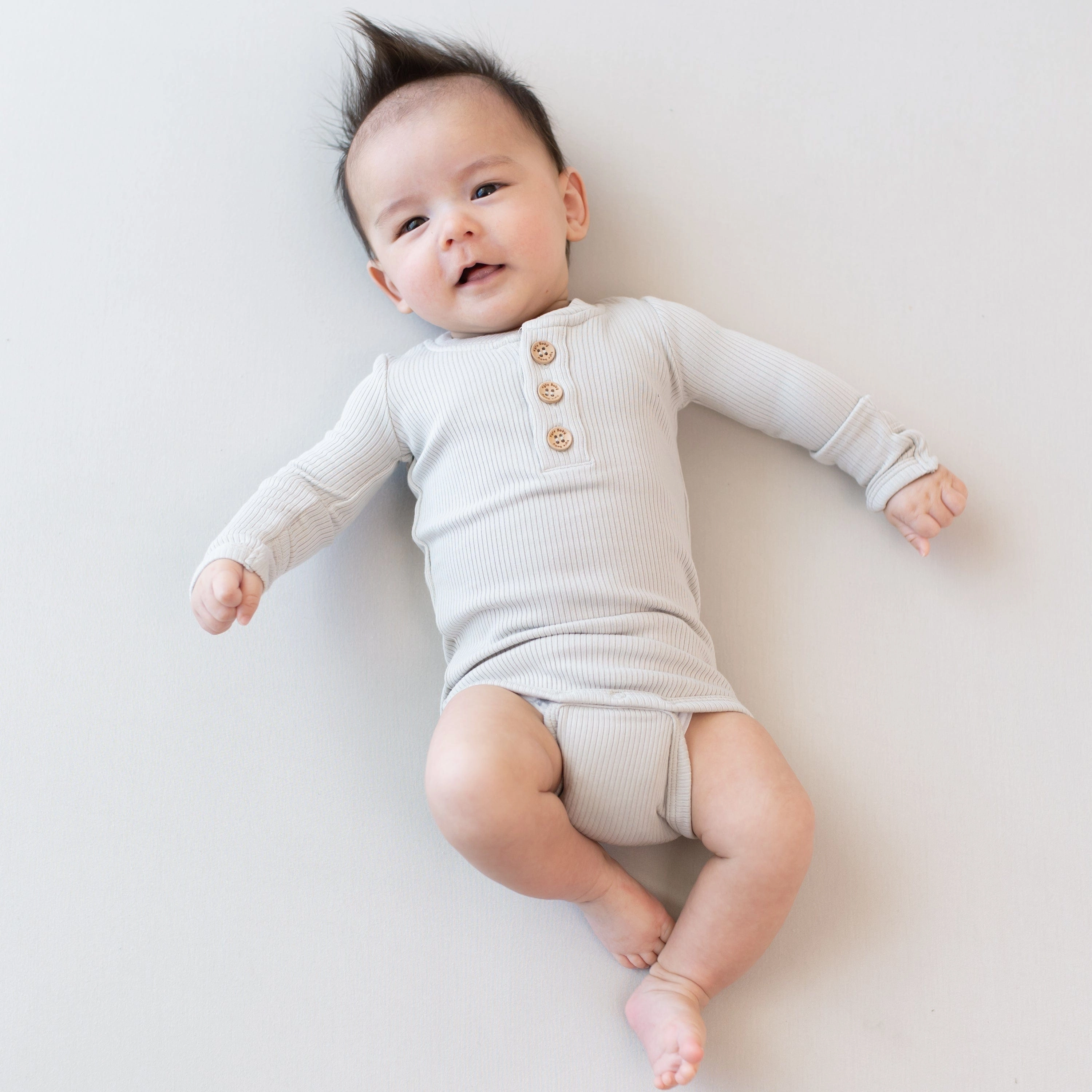 Ribbed Long Sleeve Henley Bodysuit in Oat